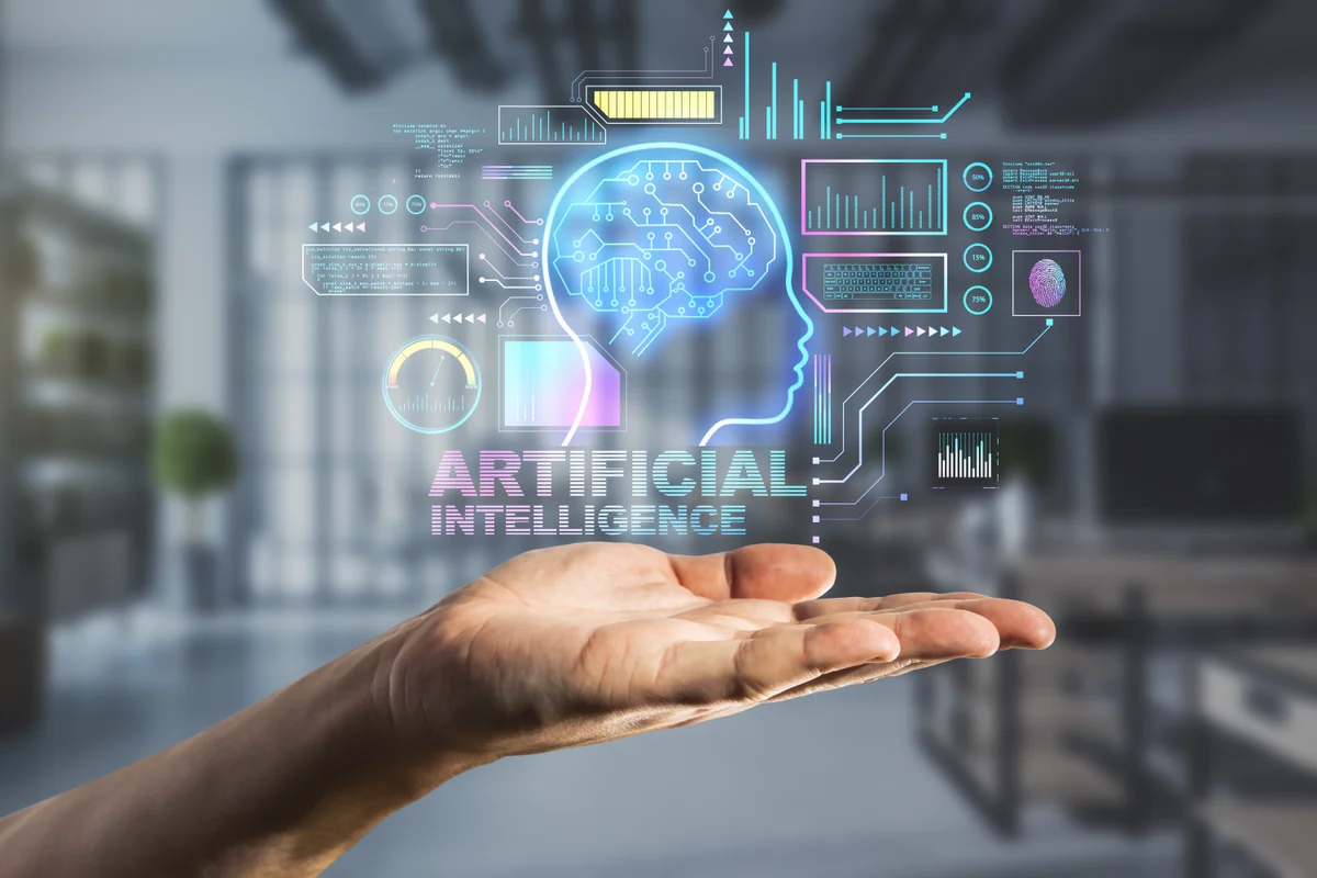 Hand holding a glowing AI brain hologram